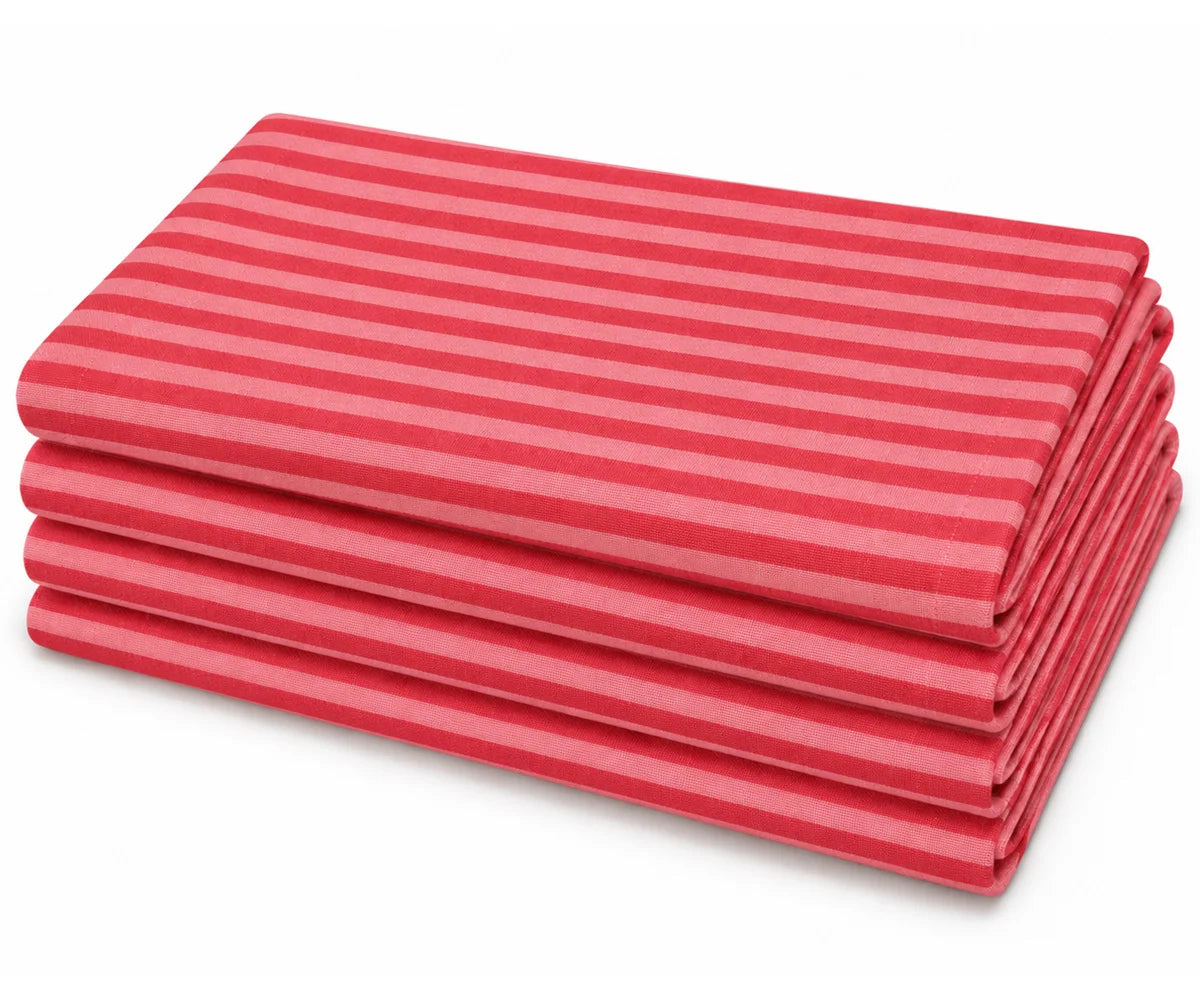 Set of folded cotton dinner napkins in a small red and pink stripe pattern, neatly stacked on a plain white background.