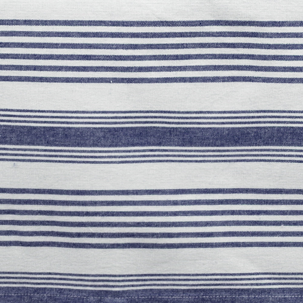 Striped cotton napkins neatly arranged on a dining table, showcasing a clean and timeless design