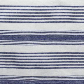 Striped cotton napkins neatly arranged on a dining table, showcasing a clean and timeless design