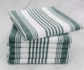 Green striped cotton kitchen towel folded on countertop
