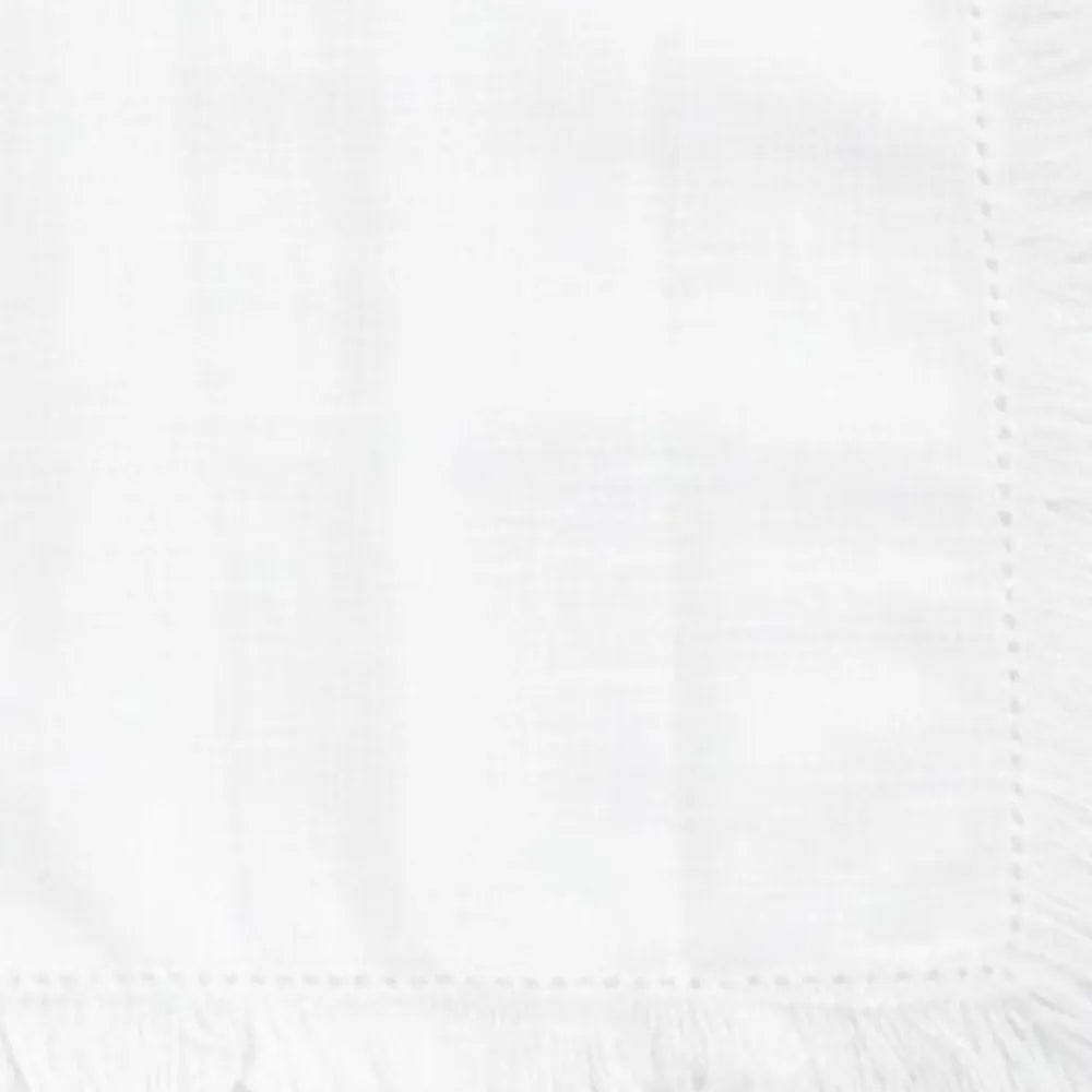 Reusable cotton dining napkins with fringe border design, suitable for home dining tables and party setups.