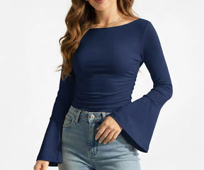 Blue organic cotton long sleeve women’s boatneck t-shirt arranged neatly to showcase its soft feel, flattering shape, and everyday style.