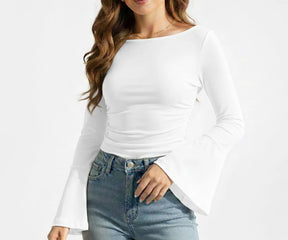 White women’s long sleeve organic cotton boatneck tee displayed on a neutral background, highlighting its lightweight and clean silhouette.