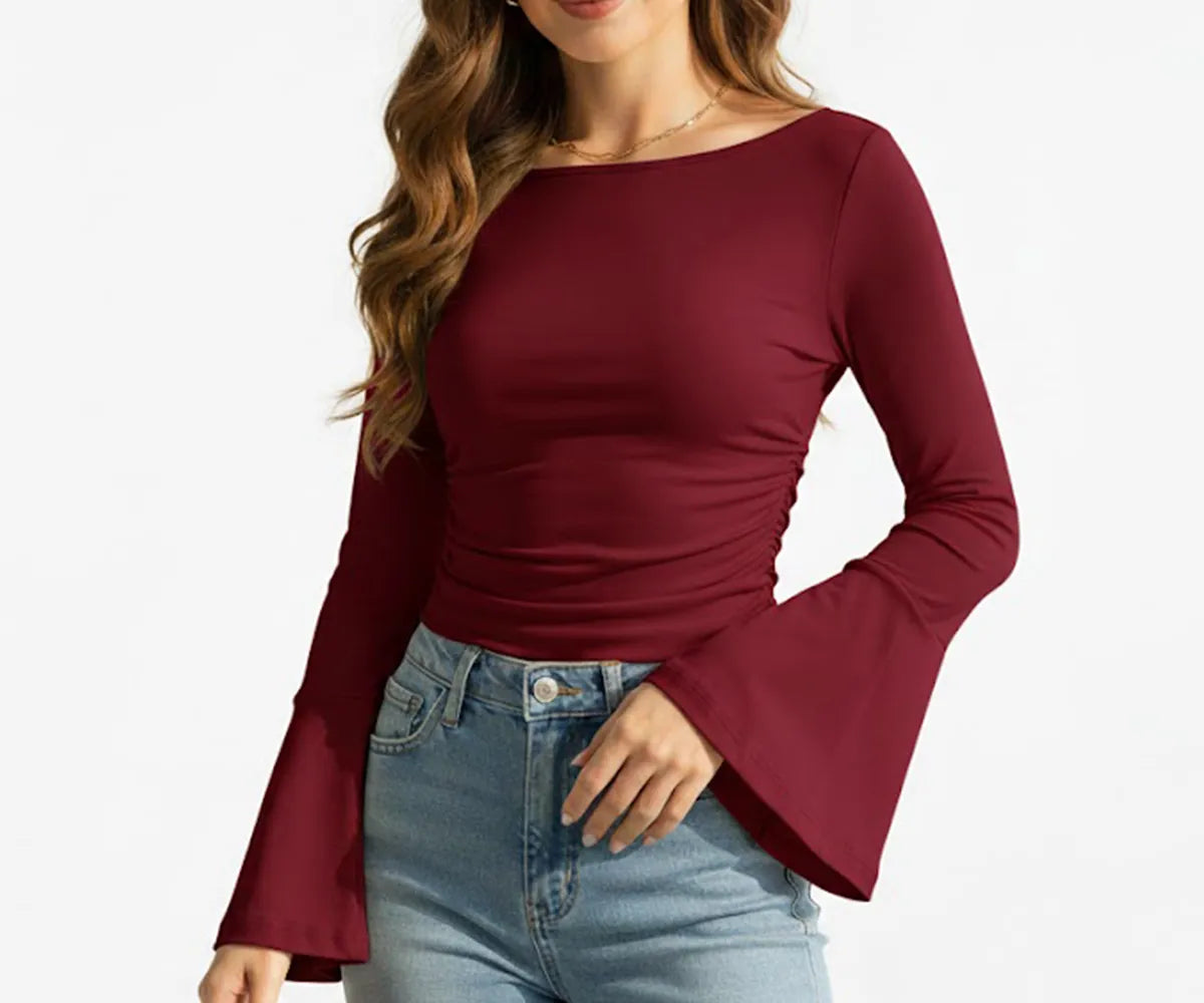 Wine red women’s long sleeve organic cotton t-shirt with boatneck design, showing rich color and smooth, eco-friendly fabric texture.