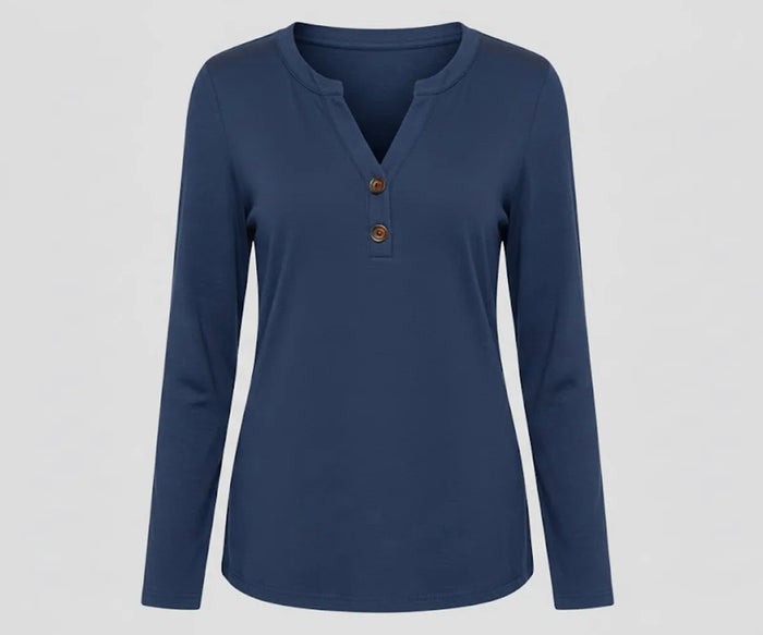 Women’s blue V-neck long sleeve organic cotton tee featuring a cool, versatile tone ideal for work, travel, and layering.
