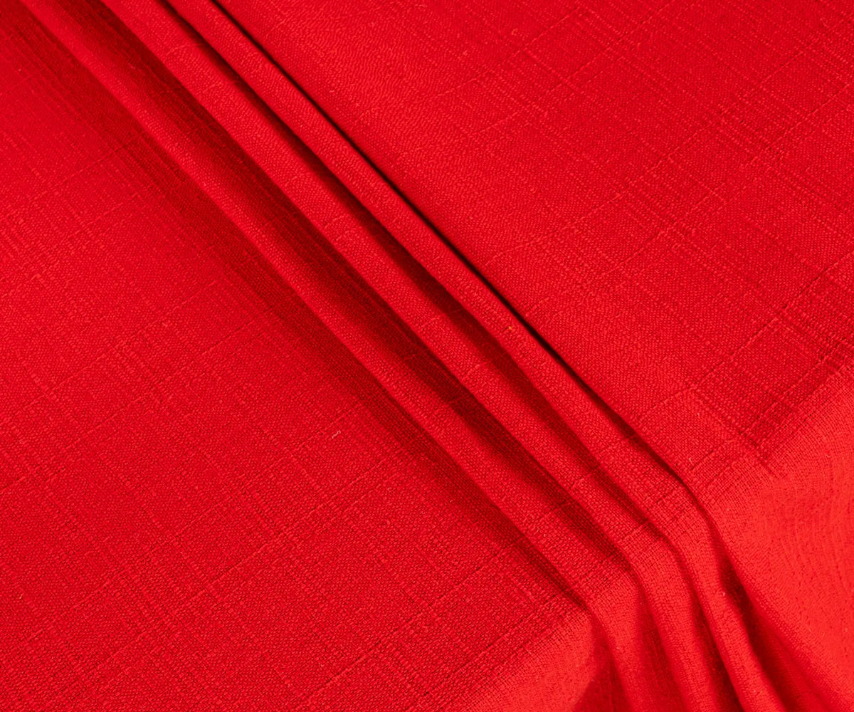 Close-up of smooth, breathable red cotton fabric tablecloth showing fine stitching and durable texture for long-lasting use.