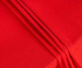 Close-up of smooth, breathable red cotton fabric tablecloth showing fine stitching and durable texture for long-lasting use.