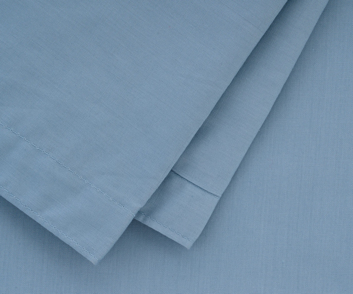 Elegant light blue cotton pillowcases with cool, soft texture for restful nights
