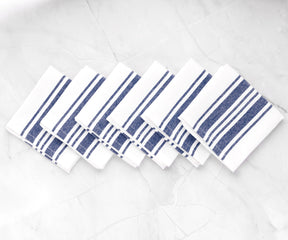 A set of blue stripe cloth napkins with a delicate linen hemstitch pattern.