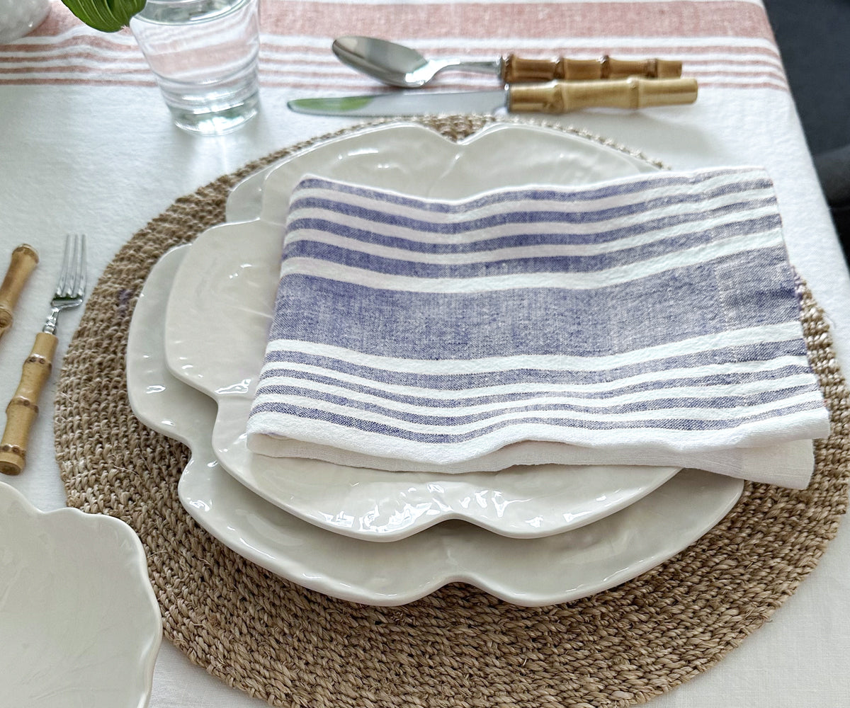 Elegant table setting featuring a linen dinner napkin and dishware