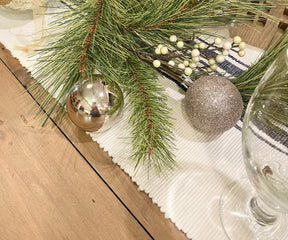 Elevate your tablescape with a farmhouse runner, showcasing understated elegance.