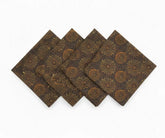 Dark beige linen dinner napkins with floral print arranged in layered display