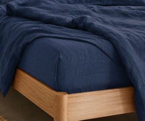 Dark blue linen sheet set with soft cooling fabric, breathable navy bedding for farmhouse, contemporary and luxury bedroom interiors