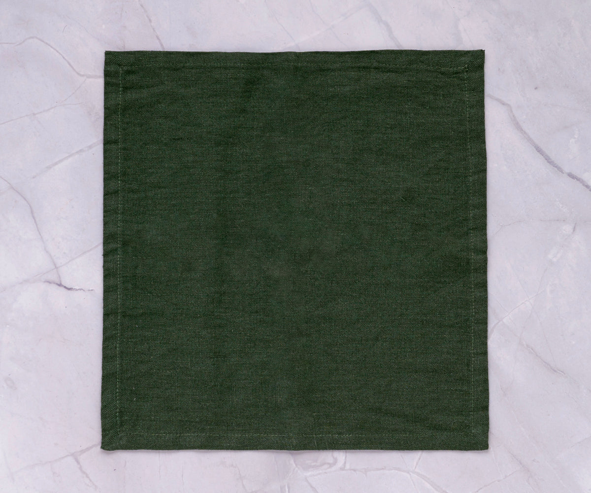 Dark green napkins, rich and bold, add a sophisticated flair to your dining table.