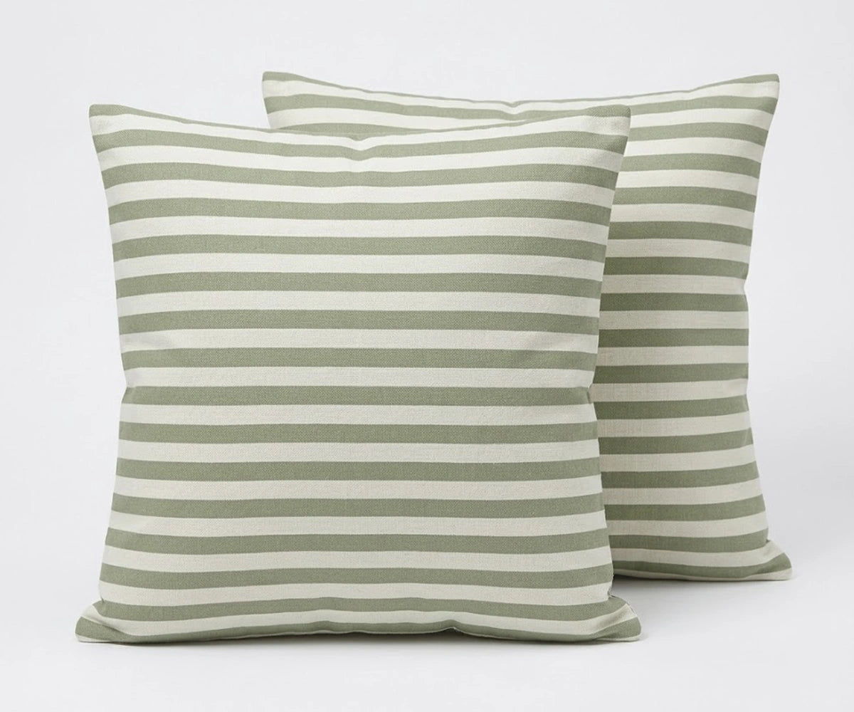 Two green and white striped pillows on a light gray background