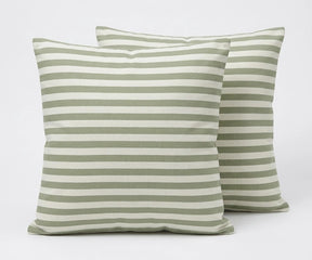 Two green and white striped pillows on a light gray background