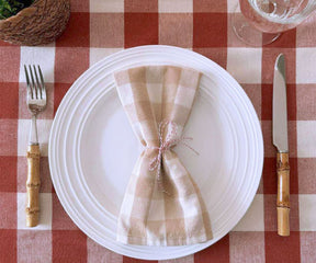 Adorning the table are a buffalo plaid tablecloth, a Christmas plaid tablecloth, a blue plaid tablecloth, and a charming round plaid tablecloth.