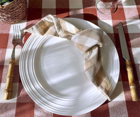 The table is graced with a buffalo plaid tablecloth, a festive Christmas plaid tablecloth, a stylish blue plaid tablecloth, and a delightful round plaid tablecloth.