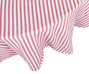 Round table set for casual brunch with red and white ticking striped tablecloth and rustic tableware