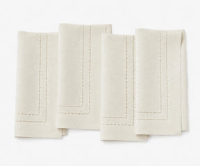 ivory linen napkins with double hemstitch, premium cloth dinner napkins for weddings, formal dining, and everyday table settings.