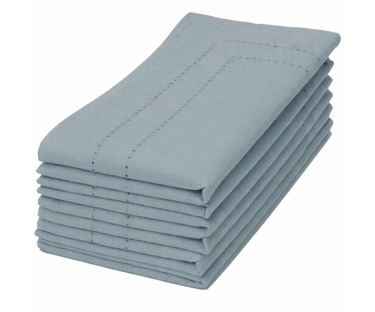 Luxurious double hemstitched tourmaline napkins elevating formal dinner tables.
