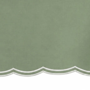 Sage green rectangular tablecloth with white embroidered border for elegant table settings