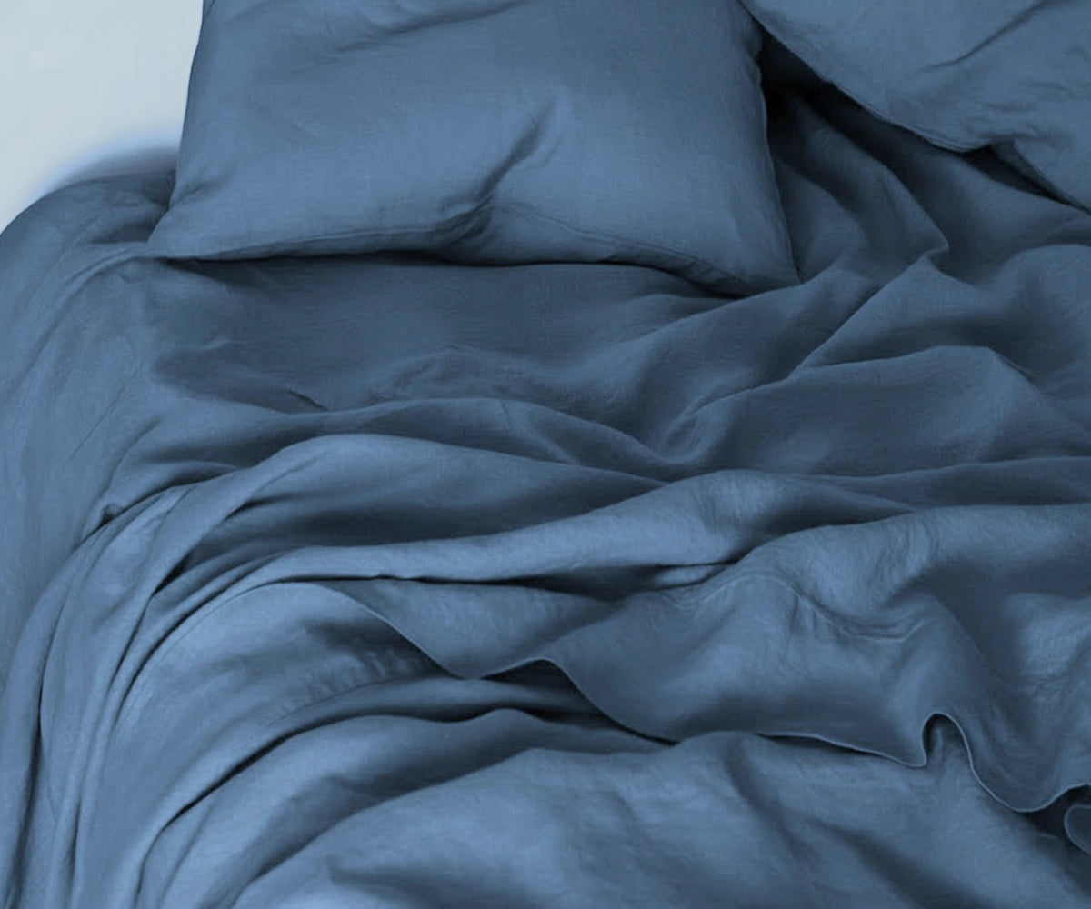 Dusty blue linen bedding set – soft pastel washed linen sheets for calm, airy bedroom décor.