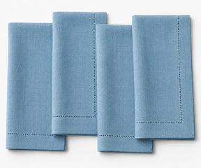 100% linen cloth napkins in dusty blue, reusable washable dinner napkins for coastal table decor, farmhouse dining, wedding receptions, holiday entertaining, and modern kitchen tables.