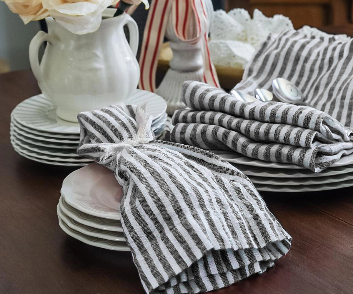 Classic black pinstripe fabric napkins paired with elegant place settings for sophisticated dining