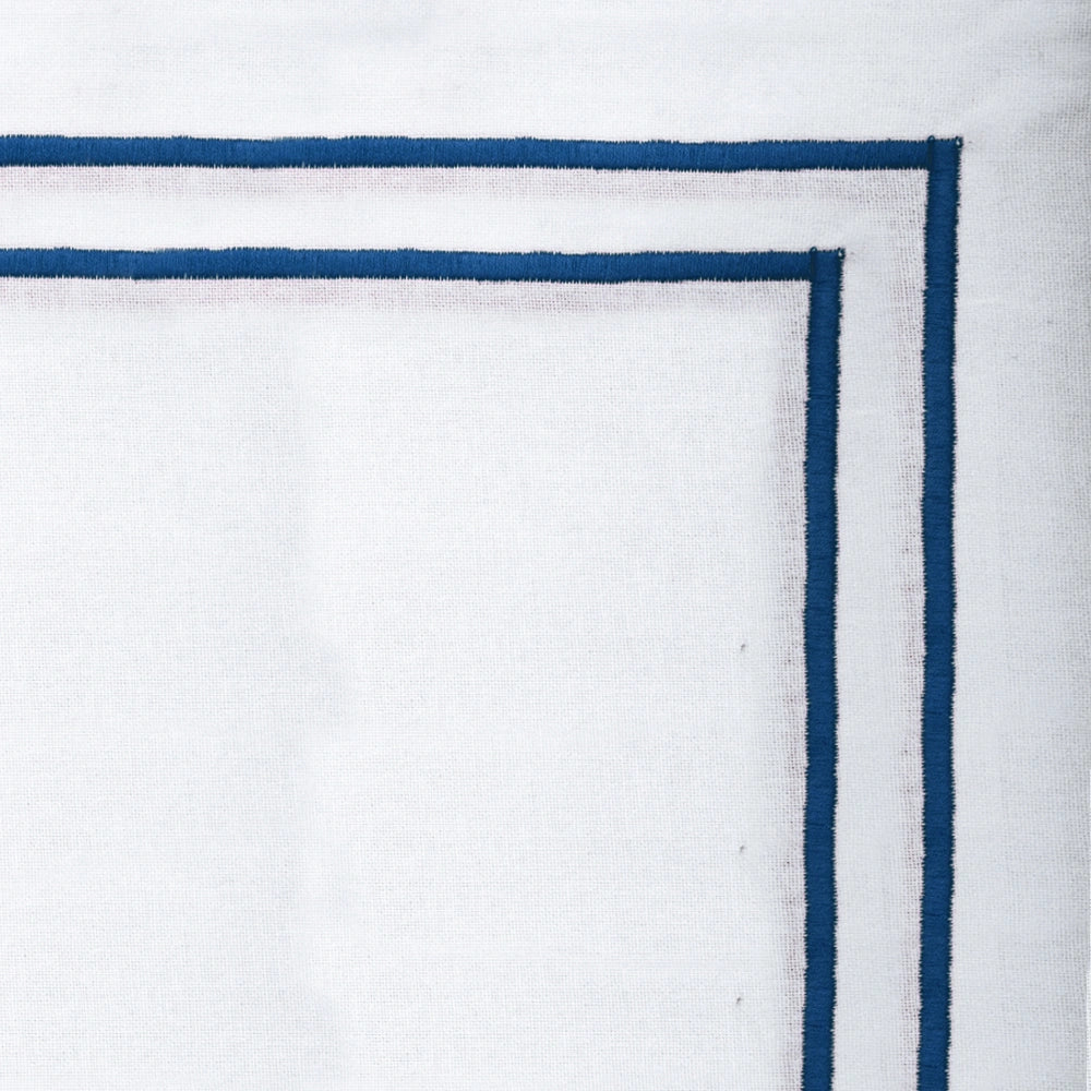 Blue embroidered cotton napkins styled on dining table, luxury fabric napkins for weddings and holiday décor