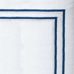 Blue embroidered cotton napkins styled on dining table, luxury fabric napkins for weddings and holiday décor