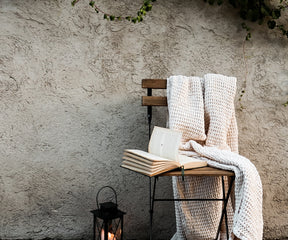 Elegant textured waffle blanket for layered bedding and stylish home setup