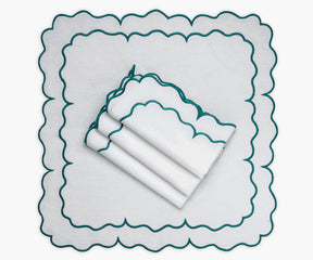 Scalloped cocktail napkins in a delightful linen fabric, perfect for special occasions.