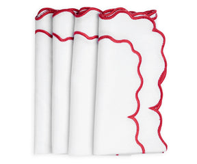 Red Linen scalloped napkins adding a sophisticated flair to your table decor.