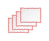 Red embroidered cotton placemats styled for a wedding table setup