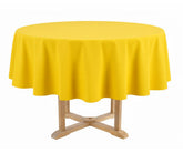 Round table with a yellow tablecloth
