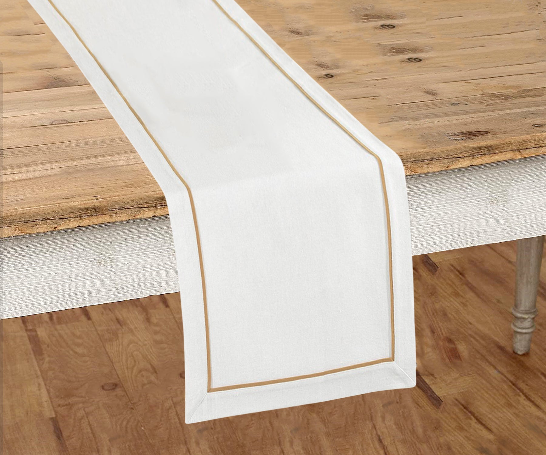 Farmhouse-inspired table runner with delicate embroidery.