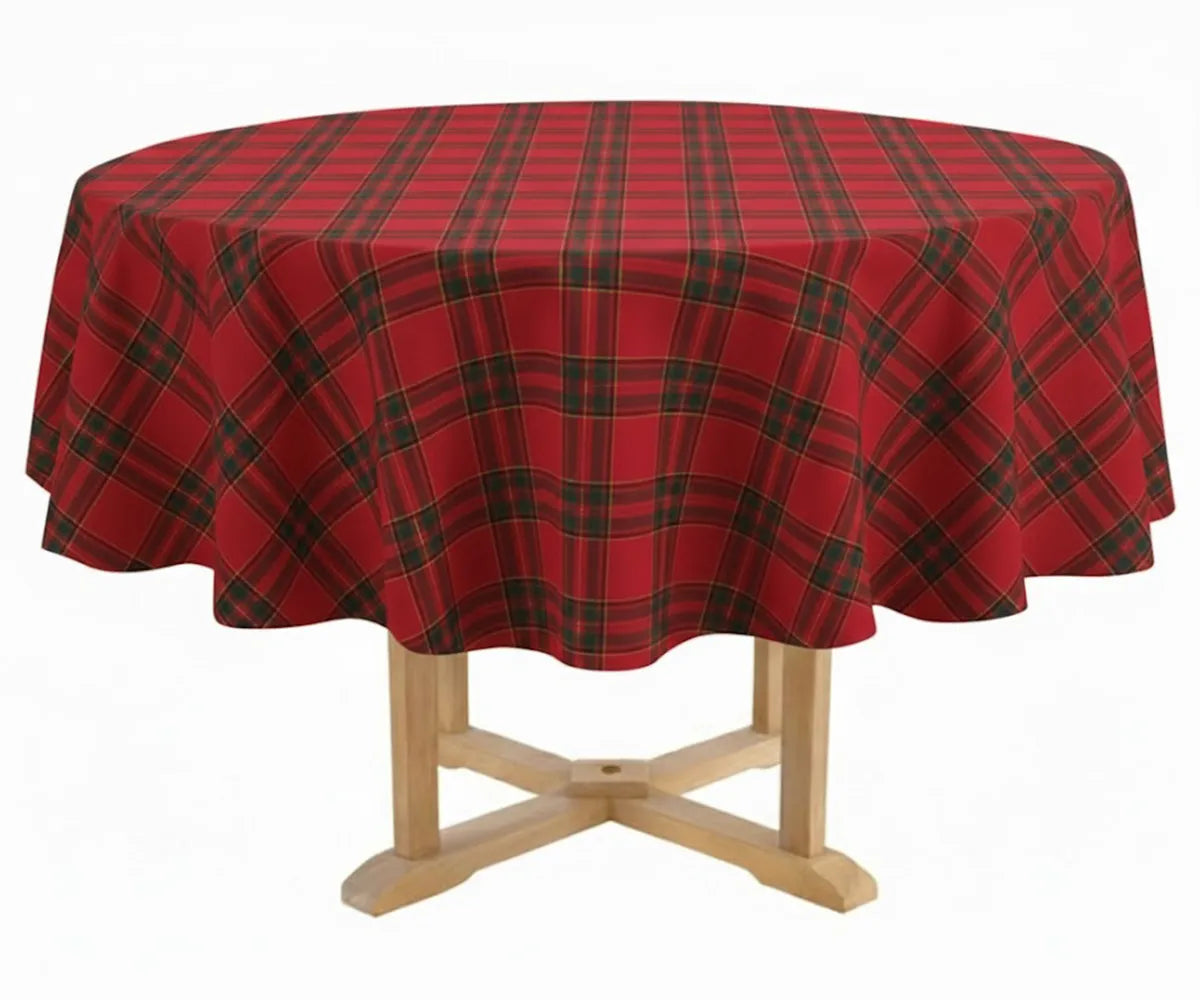 Round red, black, and yellow tartan plaid cotton tablecloth displayed on a dining table, adding festive Christmas warmth and traditional holiday style.