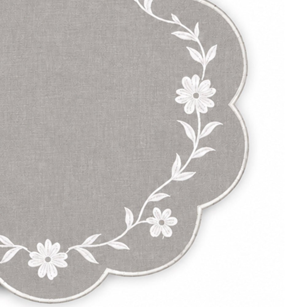 light grey scalloped placemat with white floral vine embroidery