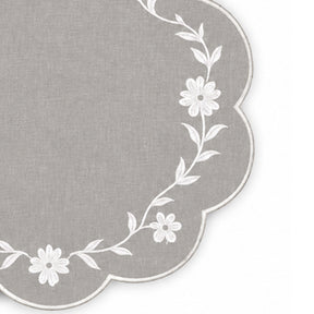 light grey scalloped placemat with white floral vine embroidery