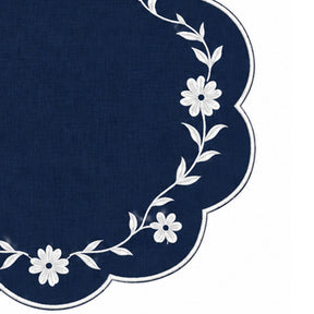 navy blue scalloped placemat with white floral vine embroidery