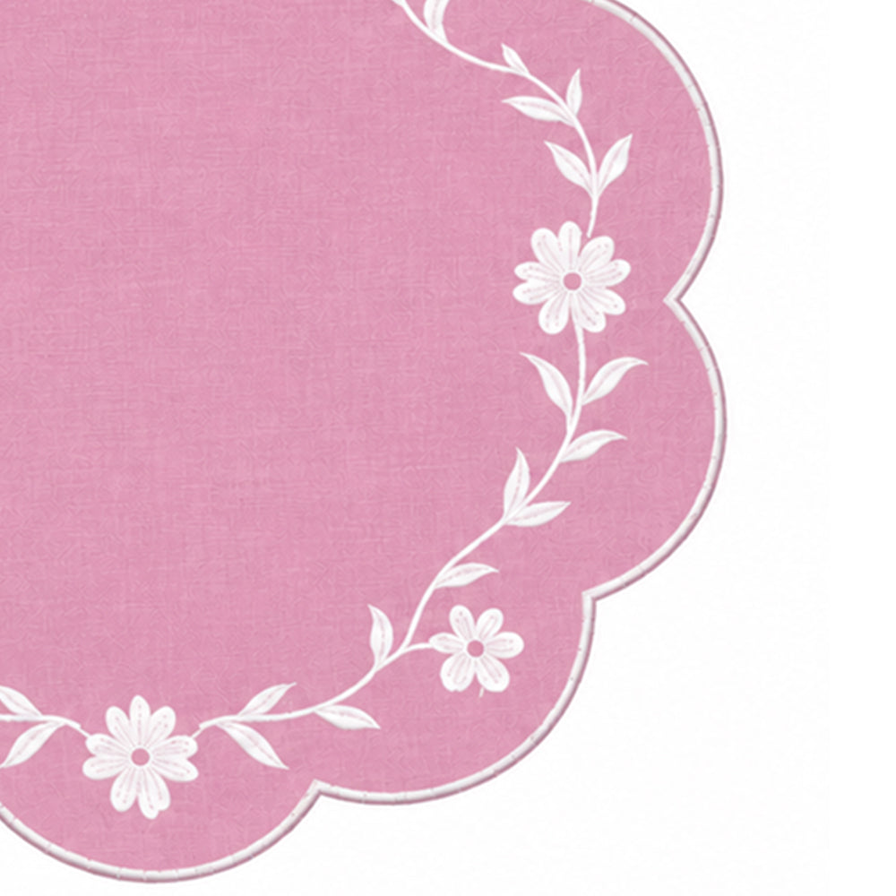 pink scalloped placemat with white floral vine embroidery