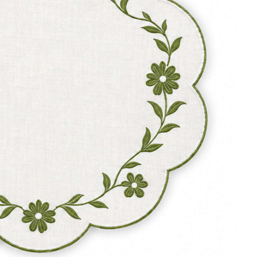 white scalloped placemat with white floral vine embroidery