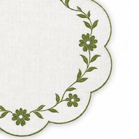 white scalloped placemat with white floral vine embroidery