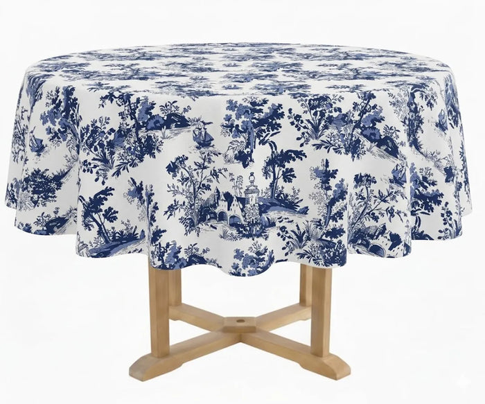 Round blue and white toile tablecloth in soft 100% cotton, featuring an elegant French floral pattern with a smooth drape, durable weave, and colorfast finish—perfect for stylish dining tables, tea settings, and classic home décor