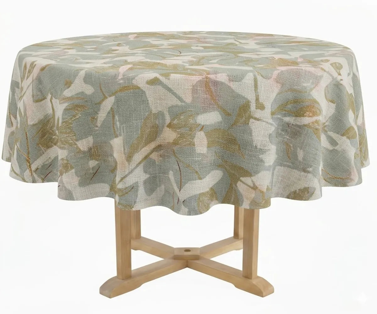 Decorative round tablecloth featuring a delicate floral pattern, elegantly draped over a pedestal dining table in a minimal product photography setup.