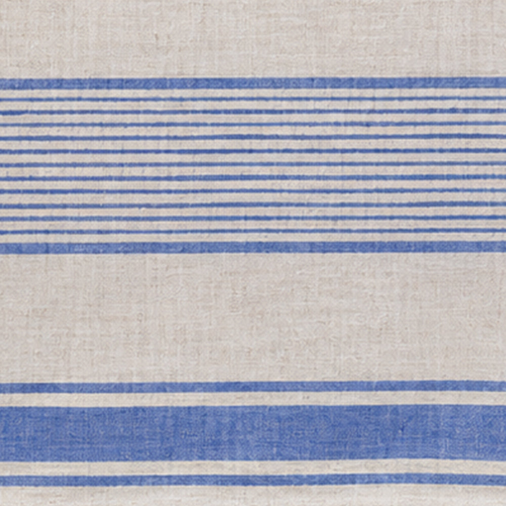 Close-up textile swatch showing the natural texture and traditional stripe weave of linen table decor.