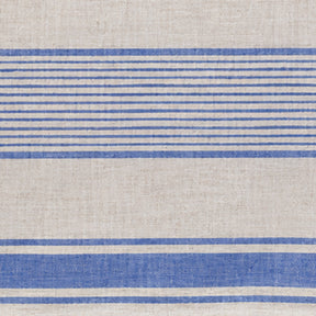 Close-up textile swatch showing the natural texture and traditional stripe weave of linen table decor.