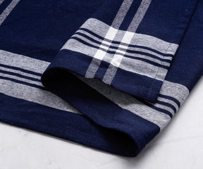 Detailed view of a blue and white striped farmhouse kitchen towel