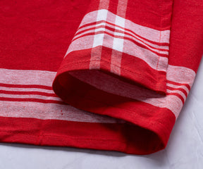 Farmhouse style kitchen hand towels with red and white stripes displayed on a kitchen counter